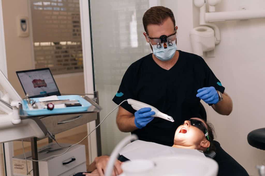 Dentist checking patient